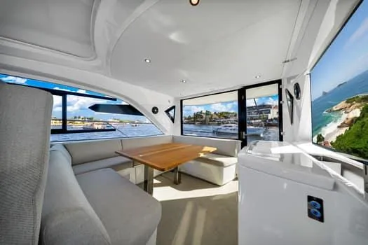 2023 Beneteau Gt45 Yacht Photos Pics Interior of 2023 Beneteau Gran Turismo 45 yacht with elegant seating and ocean view.