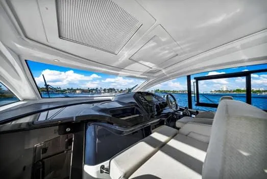 2023 Beneteau Gt45 Yacht Photos Pics Interior view of 2023 Beneteau Gran Turismo 45 yacht, featuring sleek design and waterfront scenery.