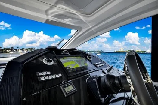2023 Beneteau Gt45 Yacht Photos Pics Cockpit view of 2023 Beneteau Gran Turismo 45 yacht with ocean backdrop.