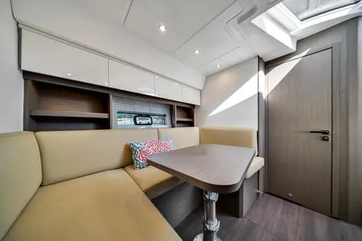 2023 Beneteau Gt45 Yacht Photos Pics Interior of 2023 Beneteau Gran Turismo 45 yacht with modern seating and table.