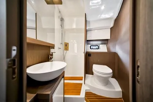 2023 Beneteau Gt45 Yacht Photos Pics Luxurious bathroom in 2023 Beneteau Gran Turismo 45 yacht with modern fixtures.