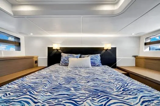 2023 Beneteau Gt45 Yacht Photos Pics Luxurious bedroom interior of 2023 Beneteau Gran Turismo 45 yacht with zebra-patterned bedding.