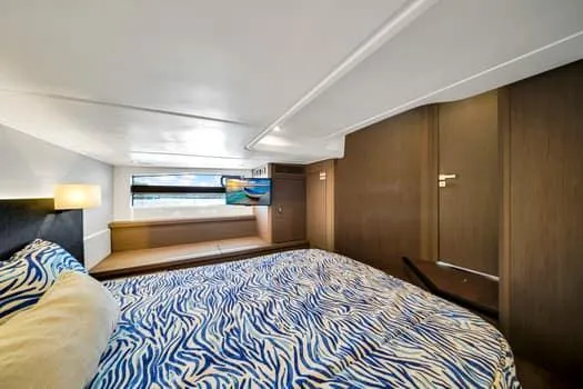 2023 Beneteau Gt45 Yacht Photos Pics Luxurious cabin interior of 2023 Beneteau Gran Turismo 45 yacht with stylish bedding.