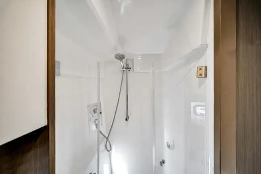 2023 Beneteau Gt45 Yacht Photos Pics Modern shower in 2023 Beneteau Gran Turismo 45 yacht bathroom.