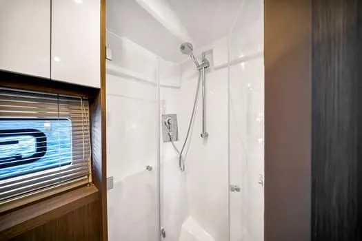 2023 Beneteau Gt45 Yacht Photos Pics Luxurious shower in 2023 Beneteau Gran Turismo 45 yacht, featuring sleek design and modern fixtures.