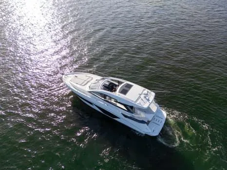 2023 Beneteau Gt45 Yacht Photos Pics 2023 Beneteau Gran Turismo 45 yacht cruising on open water, aerial view.