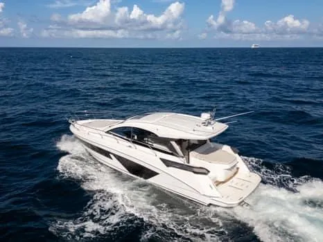 2023 Beneteau Gt45 Yacht Photos Pics 2023 Beneteau Gran Turismo 45 yacht cruising on open sea under blue sky.
