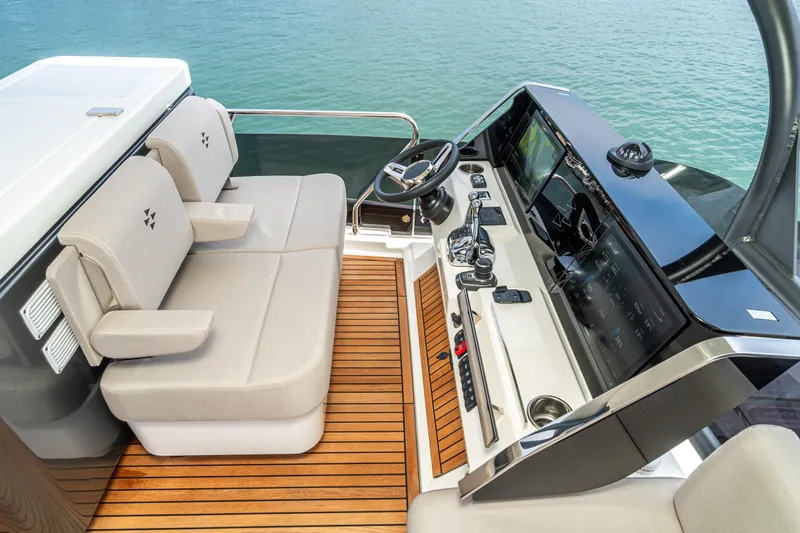  Yacht Photos Pics Luxurious 2024 Prestige X60 yacht helm with modern controls and comfortable seating.