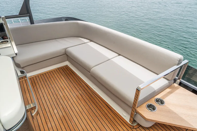  Yacht Photos Pics Luxurious seating area on 2024 Prestige X60 yacht with elegant wooden deck.