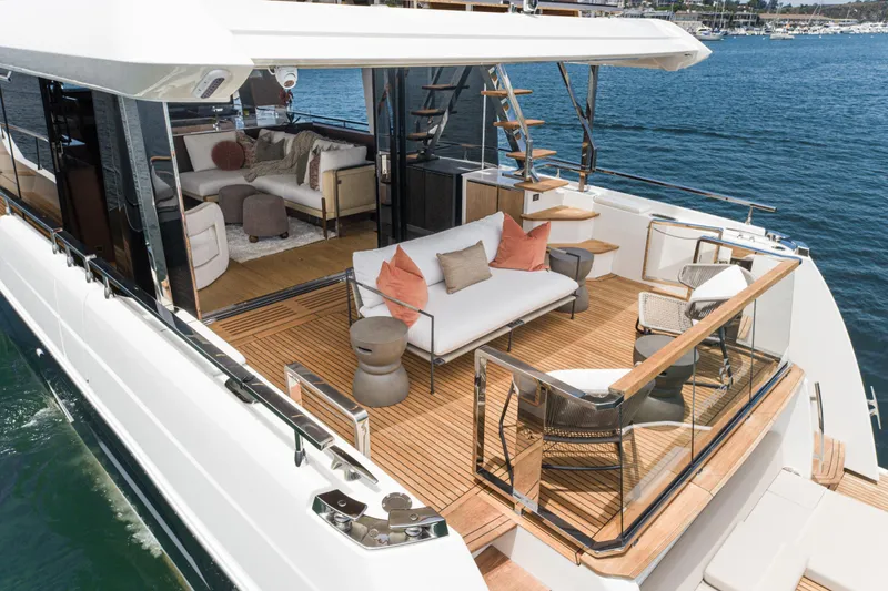  Yacht Photos Pics Luxurious 2024 Prestige X60 yacht with elegant outdoor seating and modern interior design.