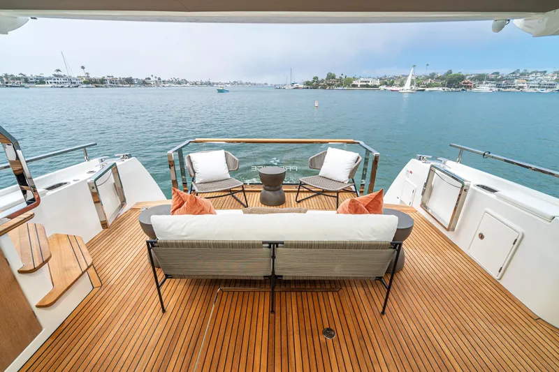  Yacht Photos Pics Luxurious 2024 Prestige X60 yacht deck with elegant seating and scenic ocean view.