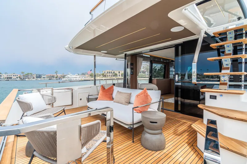  Yacht Photos Pics Luxurious 2024 Prestige X60 yacht deck with modern seating and elegant design.