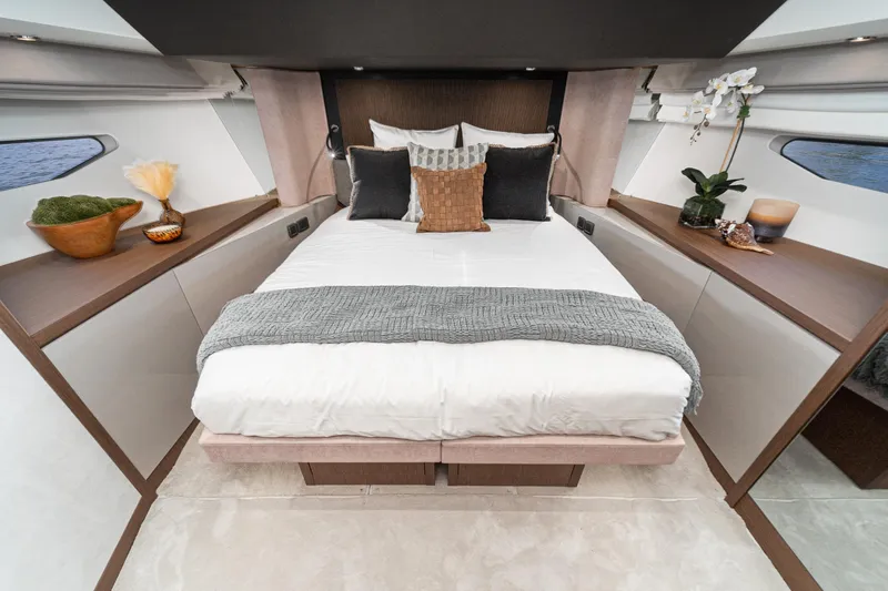  Yacht Photos Pics Luxurious bedroom interior of 2024 Prestige X60 yacht with elegant decor and cozy bedding.