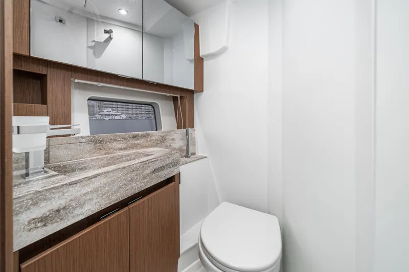  Yacht Photos Pics Luxurious bathroom in 2024 Prestige X60 yacht with modern fixtures and elegant design.