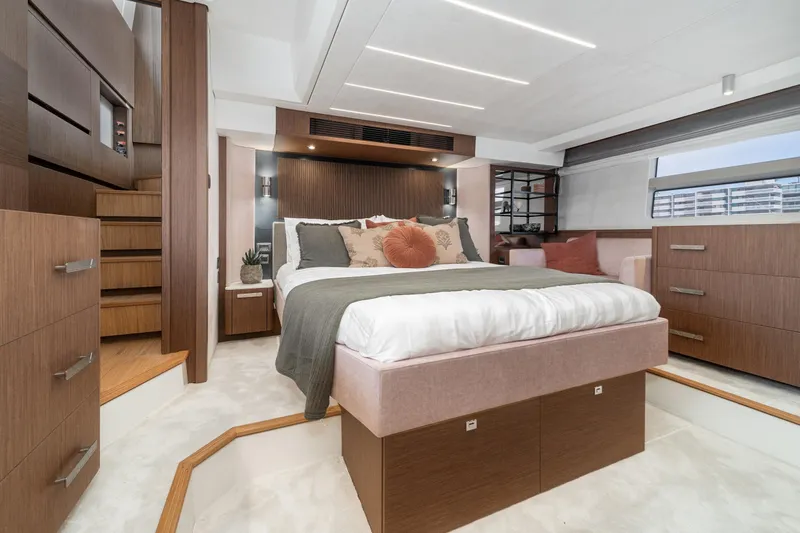  Yacht Photos Pics Luxurious 2024 Prestige X60 yacht bedroom with modern design and elegant wood finishes.