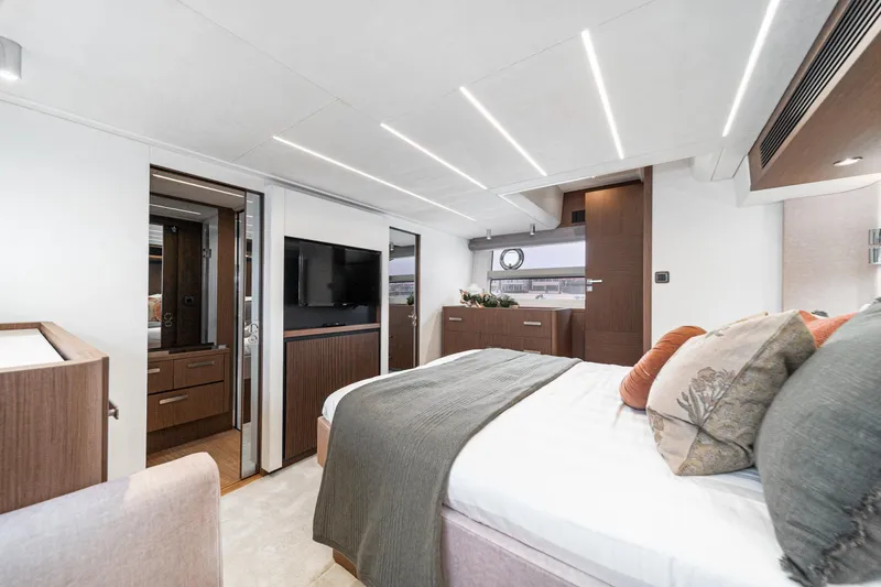  Yacht Photos Pics Luxurious 2024 Prestige X60 yacht bedroom with modern decor and ambient lighting.