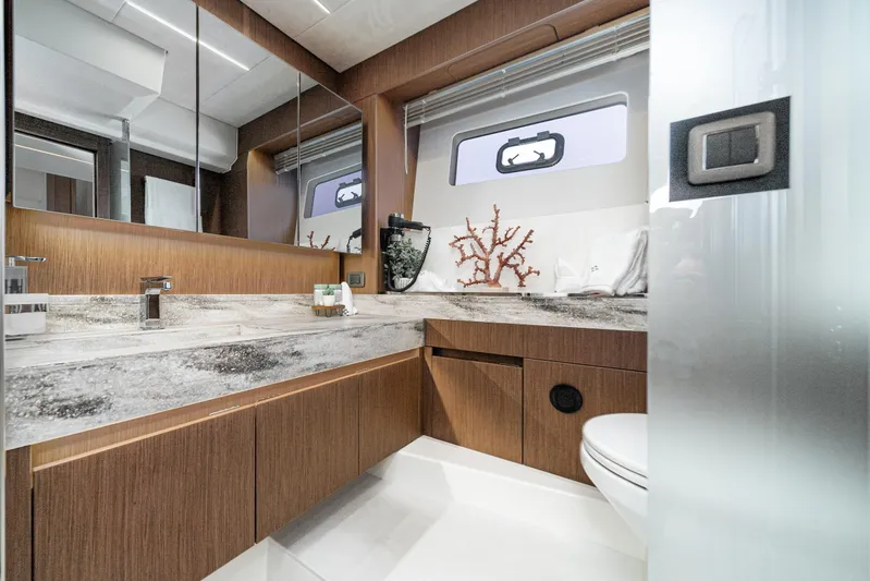  Yacht Photos Pics Luxurious bathroom in 2024 Prestige X60 yacht with modern fixtures and elegant design.