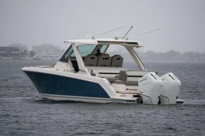  Yacht Photos Pics 2024 Tiara Sport 34 LS boat on water, featuring dual Mercury outboard engines.