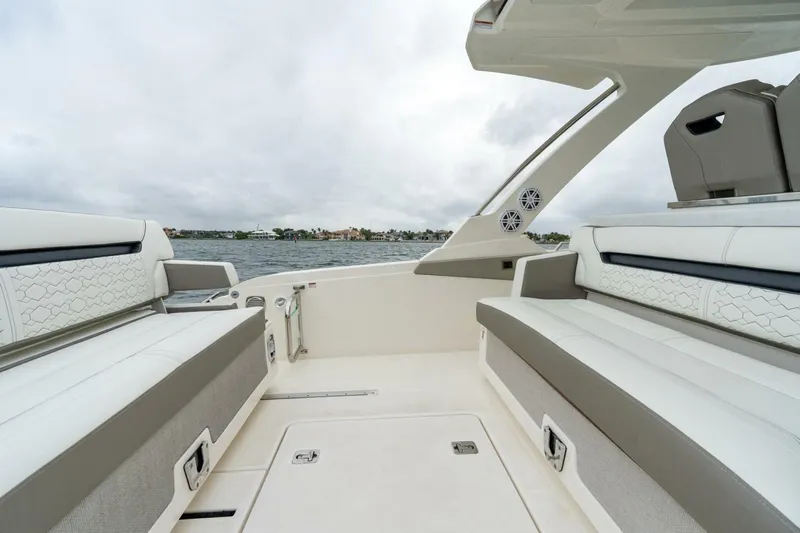  Yacht Photos Pics 2024 Tiara Sport 34 LS boat interior with luxurious seating and scenic water view.
