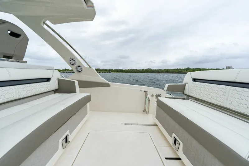  Yacht Photos Pics 2024 Tiara Sport 34 LS boat interior with luxurious seating and scenic water view.