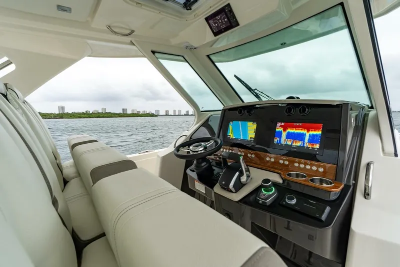  Yacht Photos Pics 2024 Tiara Sport 34 LS boat interior with advanced navigation system and luxurious seating.