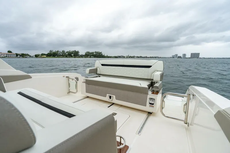  Yacht Photos Pics 2024 Tiara Sport 34 LS boat interior with luxurious seating on a cloudy day.