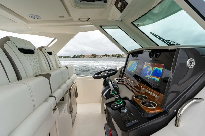  Yacht Photos Pics 2024 Tiara Sport 34 LS boat interior with advanced navigation system and luxurious seating.