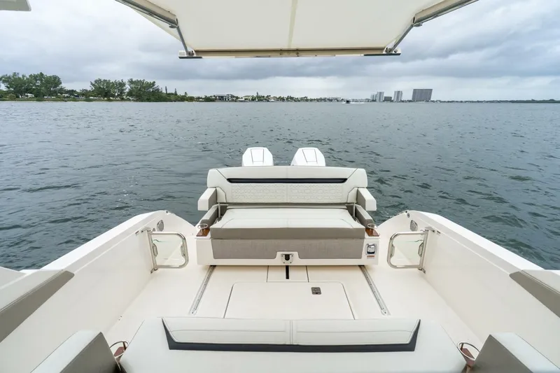  Yacht Photos Pics 2024 Tiara Sport 34 LS boat interior with seating, overlooking calm waters.