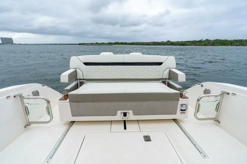  Yacht Photos Pics 2024 Tiara Sport 34 LS boat with luxurious seating on open water.