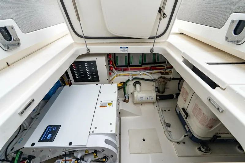  Yacht Photos Pics Engine compartment of 2024 Tiara Sport 34 LS boat, showcasing equipment and wiring.