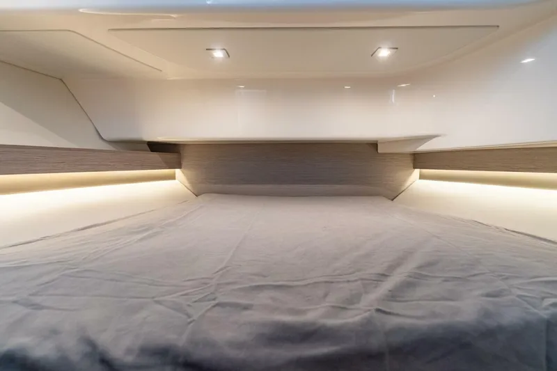  Yacht Photos Pics 2024 Tiara Sport 34 LS cabin interior with modern lighting and sleek design.
