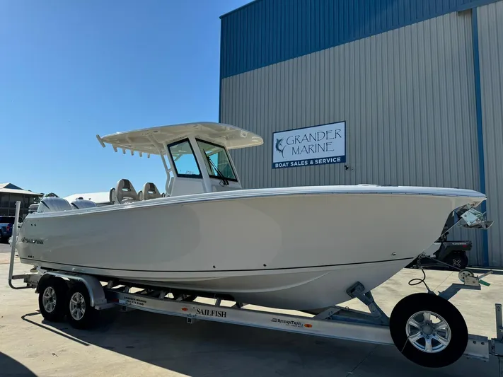  Yacht Photos Pics 2025 Sailfish 272 CC boat on trailer at dealership.