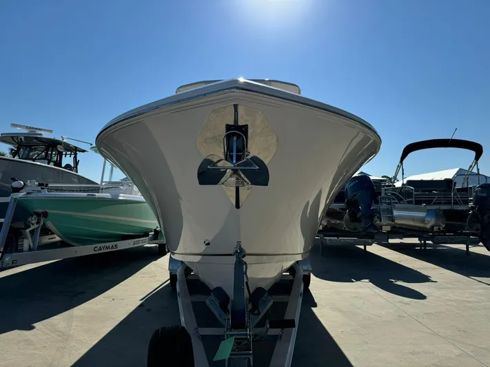  Yacht Photos Pics 2025 Sailfish 272 CC boat on trailer under clear blue sky.