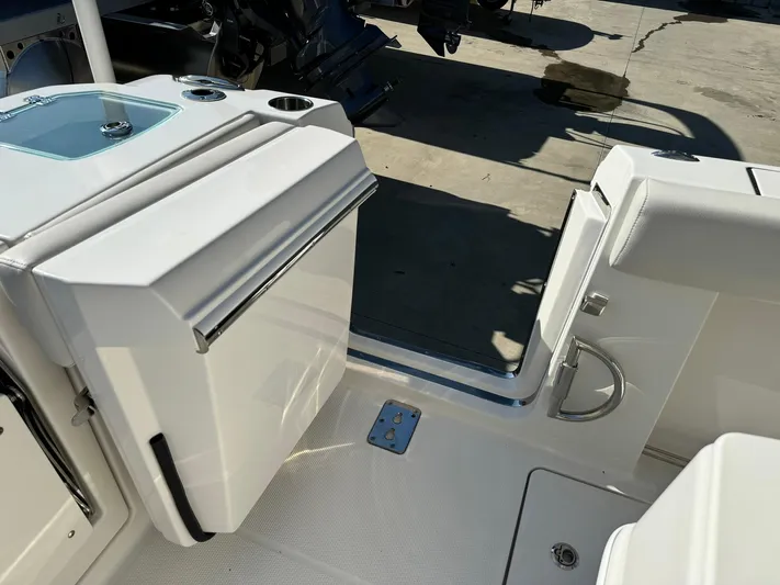 Yacht Photos Pics 2025 Sailfish 272 CC boat interior with open door and storage compartment.