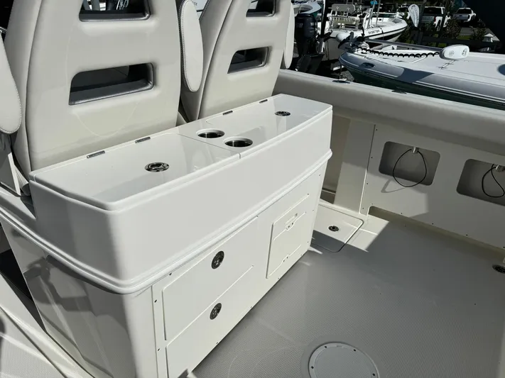  Yacht Photos Pics 2025 Sailfish 272 CC boat interior with seating and storage compartments.