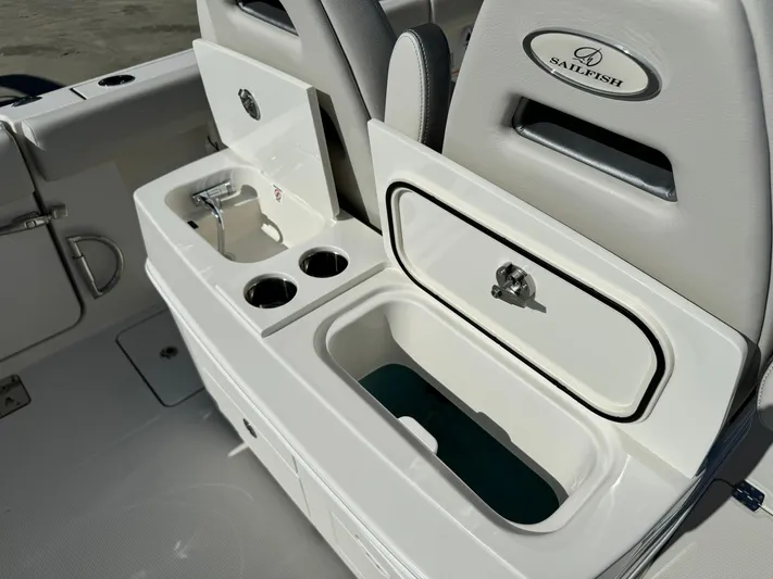  Yacht Photos Pics 2025 Sailfish 272 CC boat interior with storage compartments and cup holders.