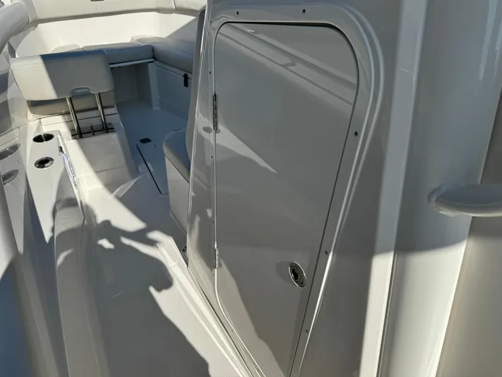  Yacht Photos Pics 2025 Sailfish 272 CC boat interior with seating and storage compartment.