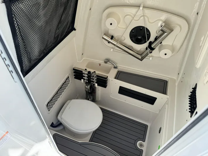  Yacht Photos Pics 2025 Sailfish 272 CC boat interior with compact bathroom and modern amenities.