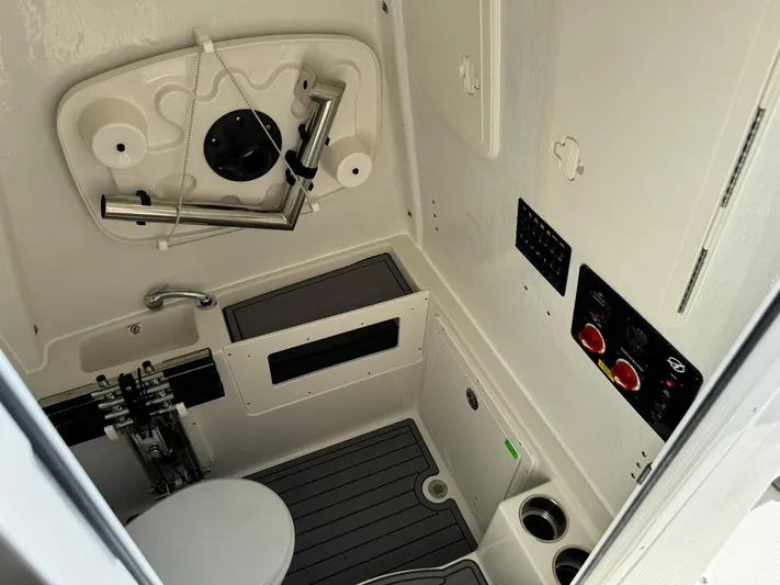  Yacht Photos Pics 2025 Sailfish 272 CC boat interior with modern controls and compact design.