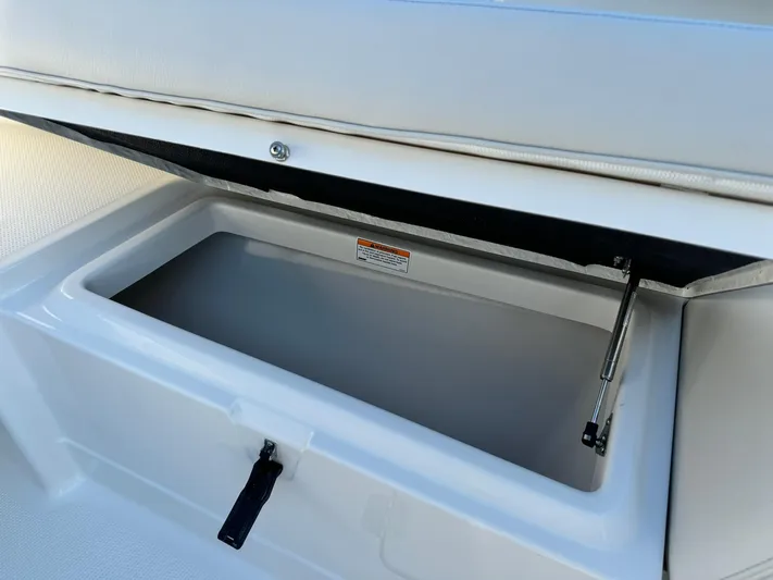  Yacht Photos Pics 2025 Sailfish 272 CC boat storage compartment with open lid.