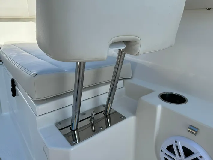  Yacht Photos Pics 2025 Sailfish 272 CC boat interior with cushioned seating and stainless steel fixtures.