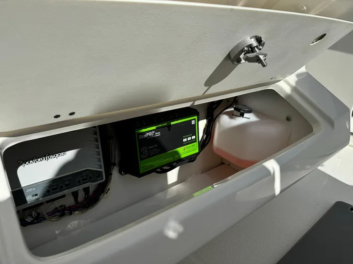  Yacht Photos Pics 2025 Sailfish 272 CC storage compartment with electronic equipment and wiring.