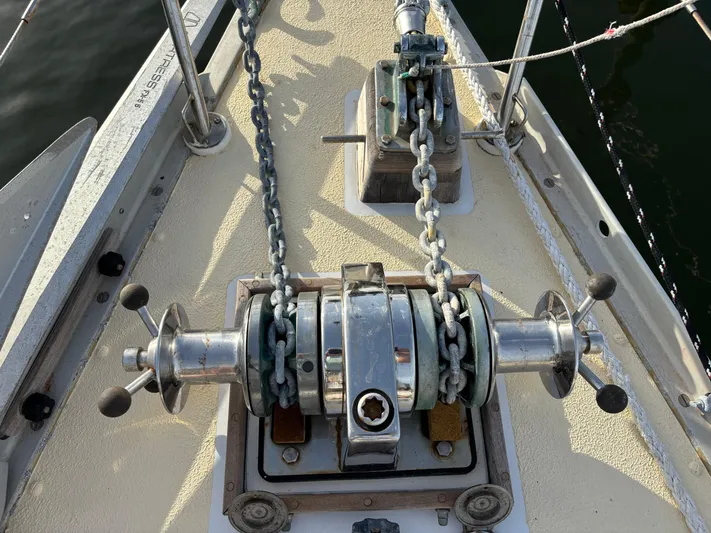 Colleen Yacht Photos Pics Anchor windlass on 1984 Cambria 44/46 sailboat deck, featuring dual chain setup.