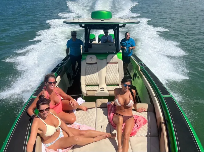  Yacht Photos Pics People relaxing on a 2018 Statement 380 Open boat cruising on the water.