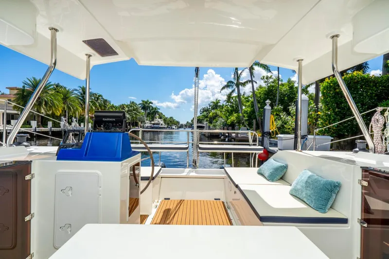  Yacht Photos Pics Luxurious 2025 Smart Cat S280 yacht interior with canal view and plush seating.