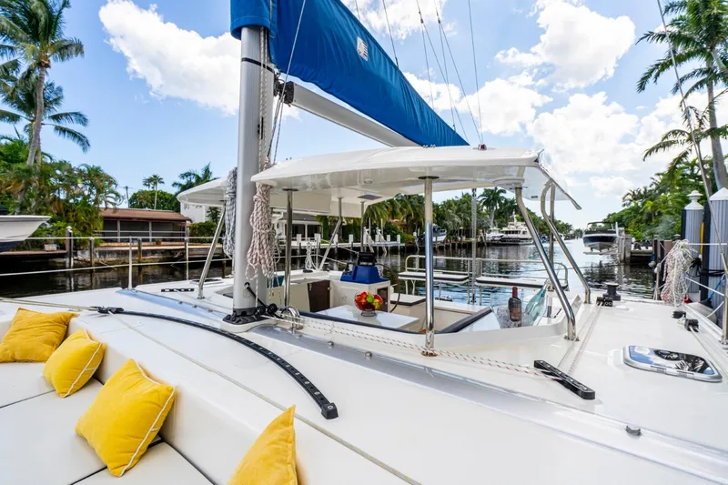  Yacht Photos Pics Luxury Smart Cat S280 yacht with yellow cushions, docked in a tropical marina, 2025 model.