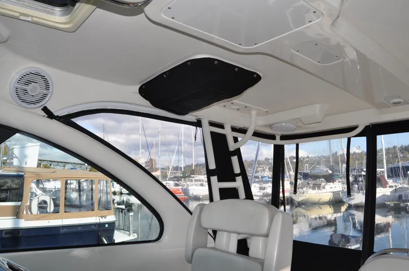  Yacht Photos Pics Interior of 2014 Pursuit OS 315 Offshore boat with marina view.
