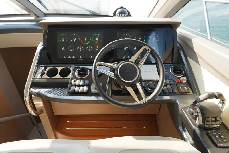 Princess F50 Model 2022 Yacht Photos Pics Cockpit of 2022 Princess F50 yacht with modern steering and navigation controls.