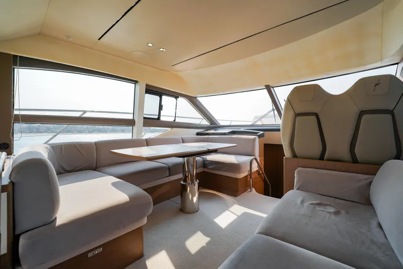 Princess F50 Model 2022 Yacht Photos Pics Luxurious interior of 2022 Princess F50 yacht with elegant seating and panoramic windows.
