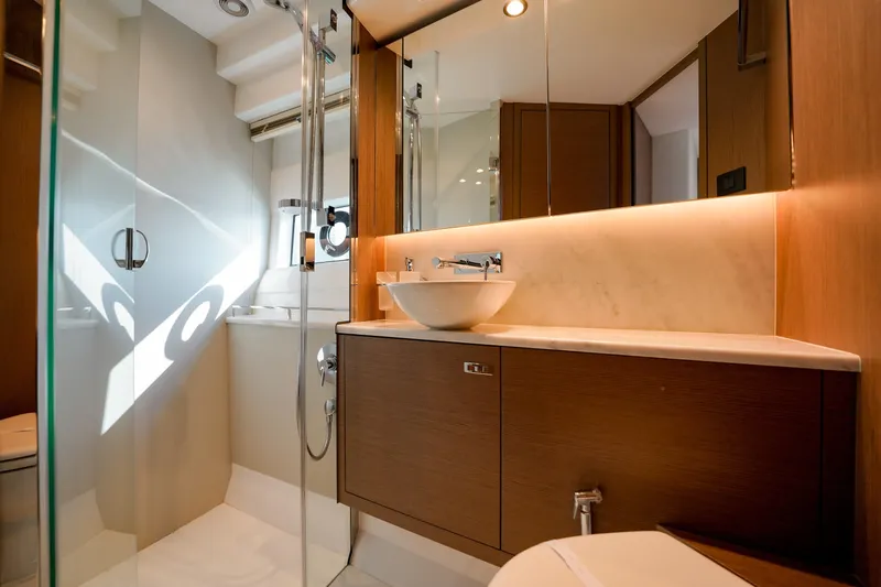 Princess F50 Model 2022 Yacht Photos Pics Luxurious bathroom interior of 2022 Princess F50 yacht with modern fixtures and elegant design.
